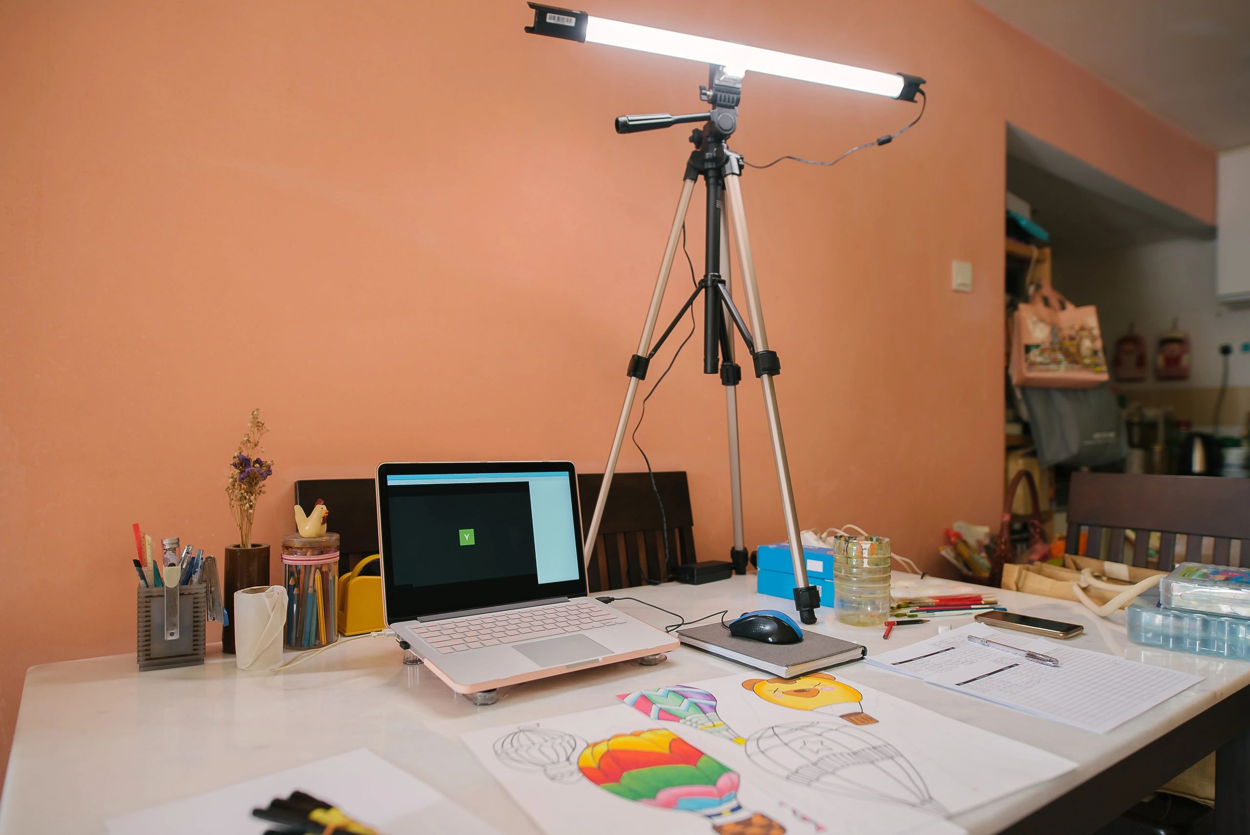 Art tools and laptop on a creative workspace desk